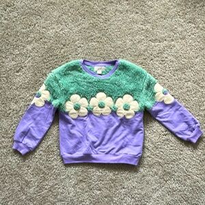 Adorable fuzzy, purple flower sweatshirt